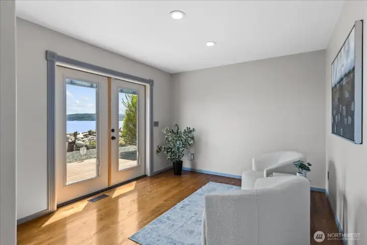 Sitting room in primary bedroom leads to the deck.