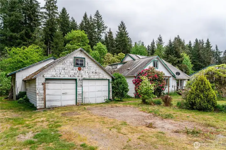 Garage with shop behind. House to the right
