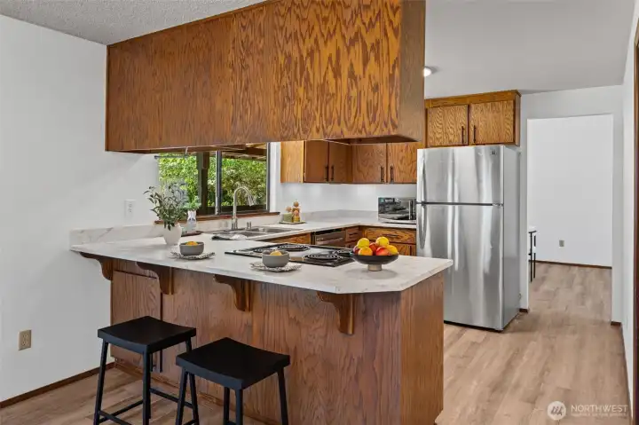 From the family room, you can appreciate the kitchen’s open design and casual counter seating perfect for gathering.