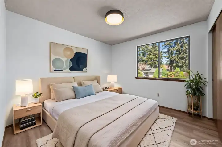 Secondary bedroom offers flexibility for guests, hobbies, or a bright home office. (Virtually Staged)