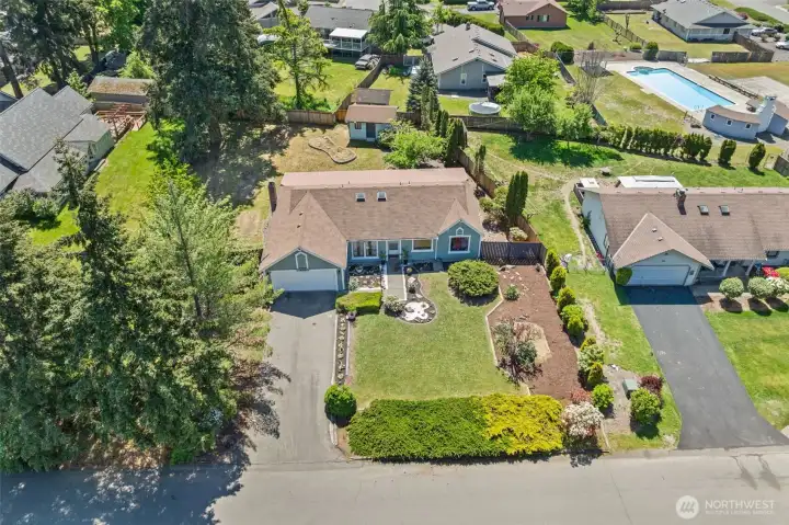 With the community pool nearby and a welcoming neighborhood feel, this is the kind of place people hope to call home.