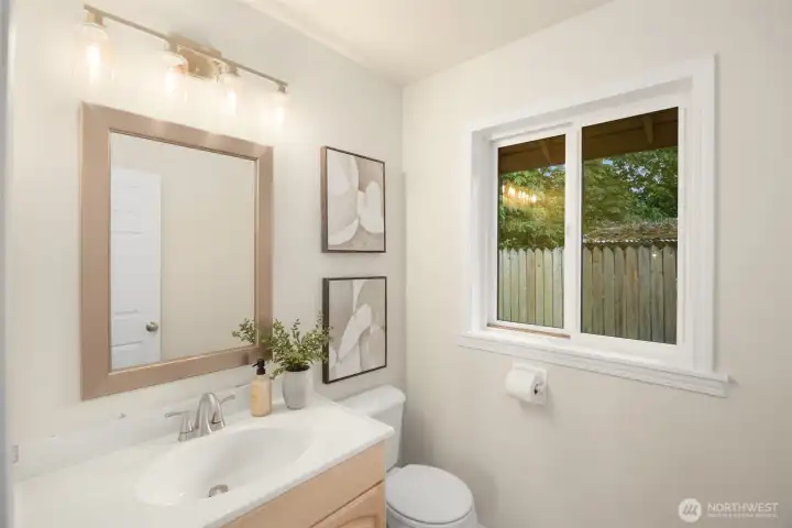 Half bath off kitchen, family room and deck for guests and easy everyday living. Half bath off kitchen, family room and deck for guests and easy everyday living.