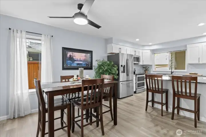 Bright, open-concept floor plan featuring a seamless transition from the kitchen to the dining area. Bright, open-concept floor plan featuring a seamless transition from the kitchen to the dining area.