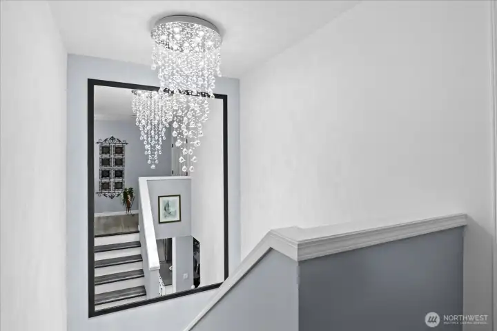 The crystal chandelier creates an elegant focal point, adding a touch of sophistication and charm to the space. The crystal chandelier creates an elegant focal point, adding a touch of sophistication and charm to the space.