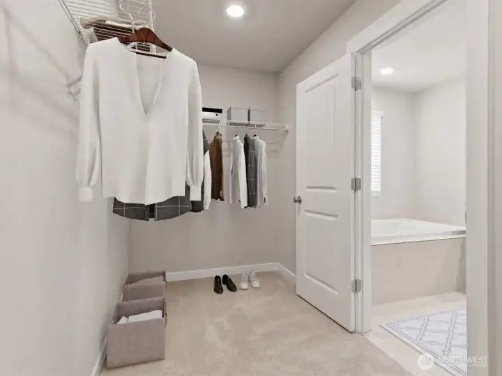 Primary bedroom walk in closet.  Pictures for representational purposes only, colors and included features may vary. Soaking tub not available at Stetson Heights