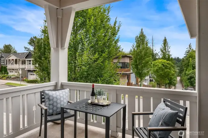 Seamlessly extending the great room outdoors, the covered balcony offers a welcoming space to relax, entertain, or simply enjoy a quiet moment overlooking the neighborhood. Seamlessly extending the great room outdoors, the covered balcony offers a welcoming space to relax, entertain, or simply enjoy a quiet moment overlooking the neighborhood.