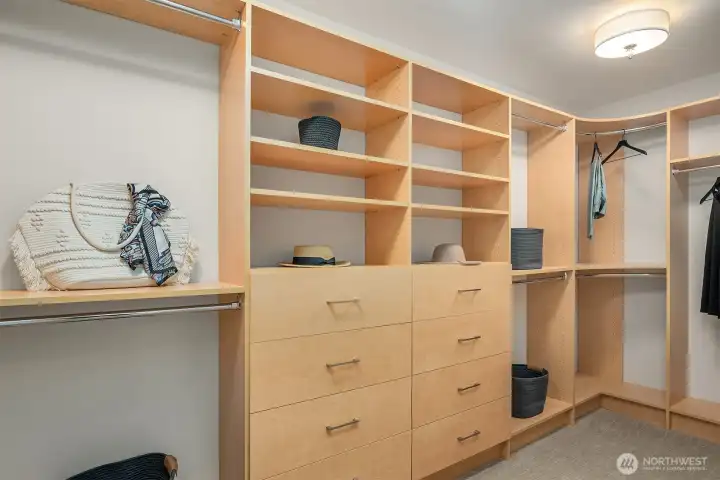 Designed to function like a private dressing room, the expansive walk-in closet features custom built-in organization with adjustable shelving, extensive hanging space, integrated drawer storage, and thoughtfully designed compartments that maximize both beauty and functionality. Designed to function like a private dressing room, the expansive walk-in closet features custom built-in organization with adjustable shelving, extensive hanging space, integrated drawer storage, and thoughtfully designed compartments that maximize both beauty and functionality.
