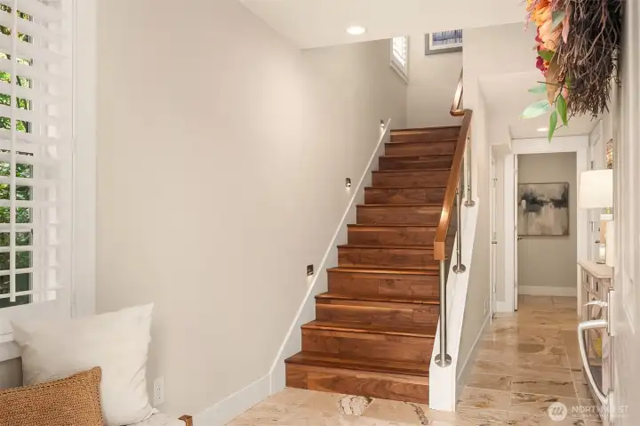 Head down to the entry level - a warm welcome, where rich materials and timeless design set the tone for the home beyond. Head down to the entry level - a warm welcome, where rich materials and timeless design set the tone for the home beyond.