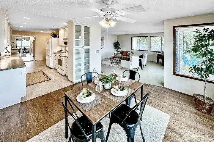 Open floor plan with south and west facing windows assuring natural light and beautiful Northwest views. Notice the floor to ceiling cabinet with glass doors. Open floor plan with south and west facing windows assuring natural light and beautiful Northwest views. Notice the floor to ceiling cabinet with glass doors.