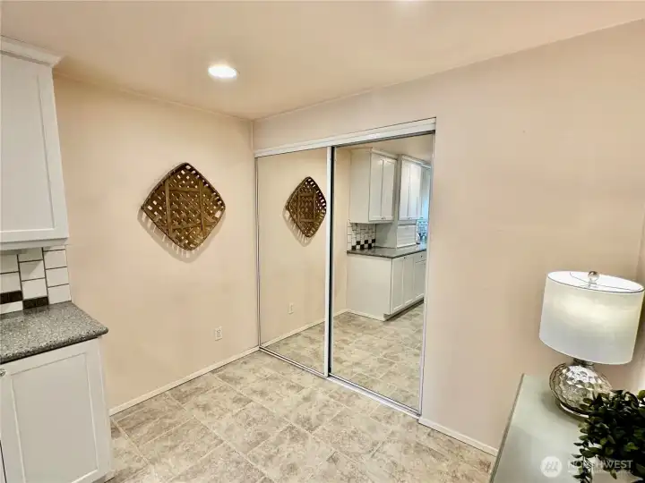 This shows the breakfast nook area and access to the huge pantry behind the glass sliding doors. This shows the breakfast nook area and access to the huge pantry behind the glass sliding doors.