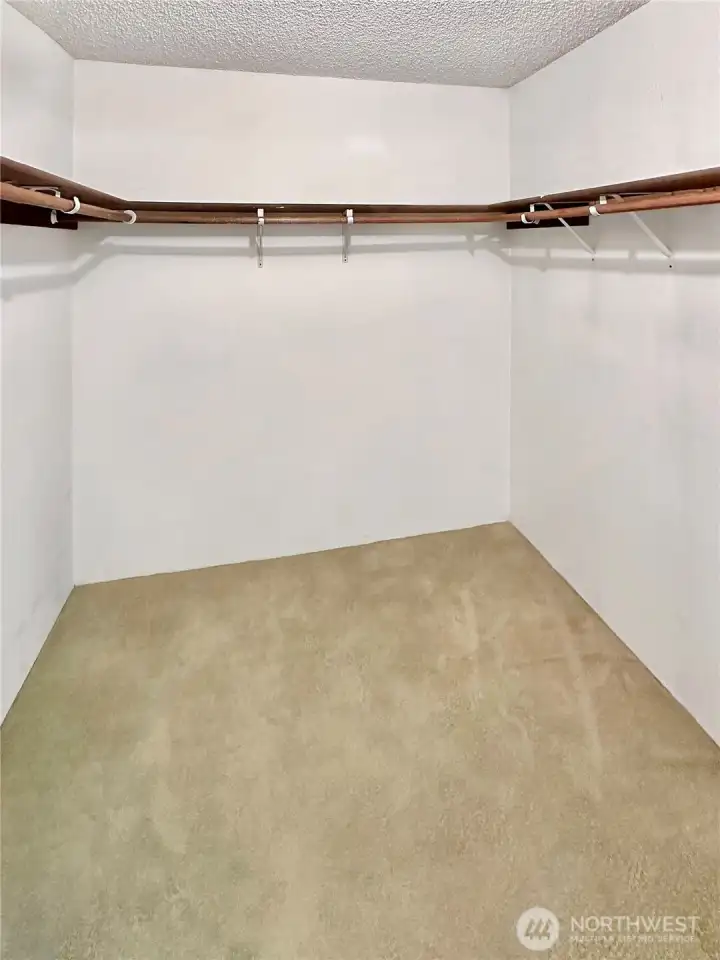 Primary walk-in closet. Primary walk-in closet.