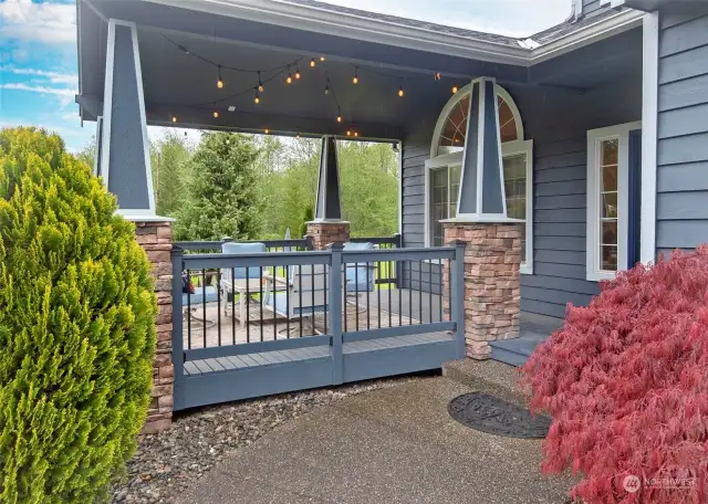 Enjoy the warm evening under this covered front porch.