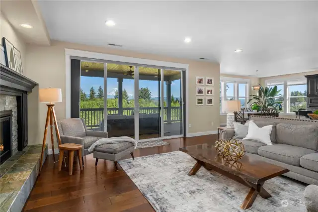 Spacious living room with fireplace and views.