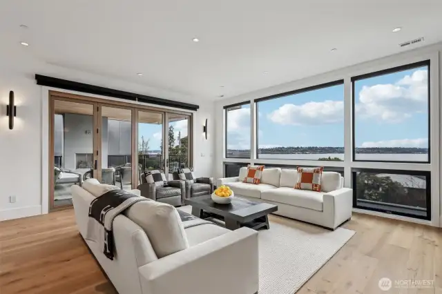 Enjoy peaceful lake views from the comfort of your living room that connects to the covered patio.