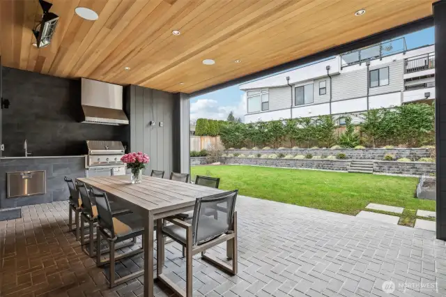 There is nothing more comfortable dining in the heated and covered BBQ area. Custom motorized weather shade keeps this space sheltered and private.