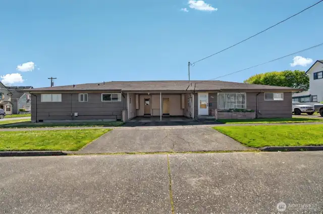 Duplex has carport pace for each unit.