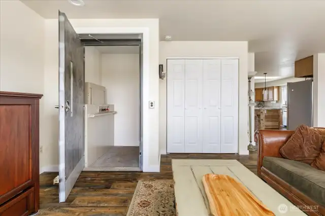 Elevator door in living room connects to garage level.