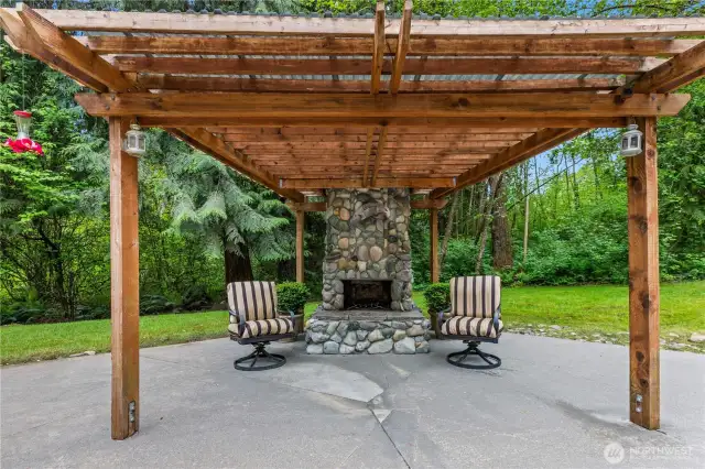 11-Foot river rock fireplace with covered seating area