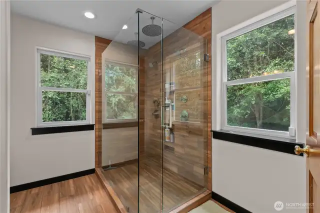 Luxury two-person temperature control, multi-head shower with full glass surround and heated floors