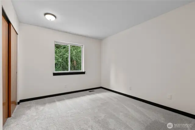 Secondary bedroom with new carpet and paint