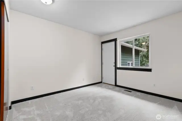 Another secondary bedroom or home office (door leads to small deck and theatre room)