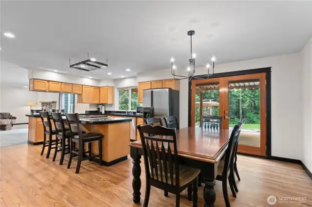 The open kitchen/dining/family areas