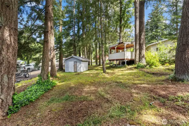 Storage shed for your lawn maintenance items, plus a covered outdoor hangout area!