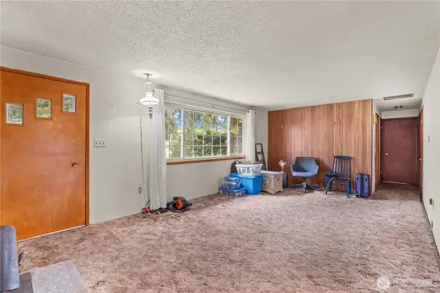 Living room with bedrooms down the hall to the right