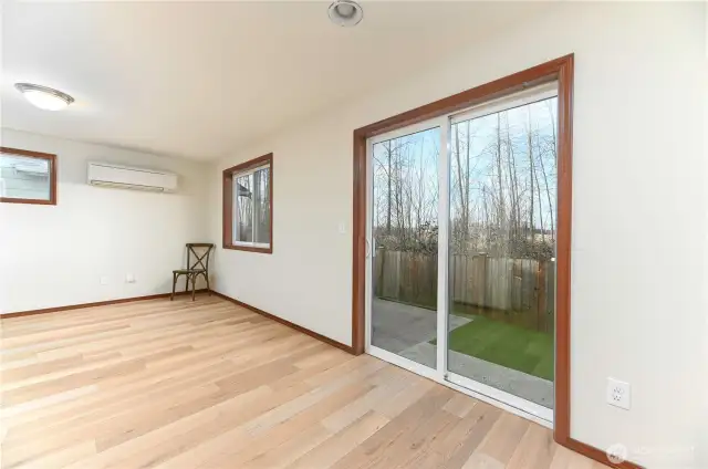 dining room with sliding door to back patio and fully fenced back yard