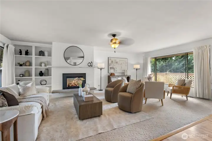 Bright and inviting living room with custom built-ins and garden views.