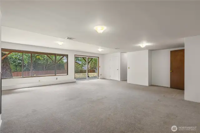 Large windows brighten the lower level. Great flex space for hobbies, play, or family room.