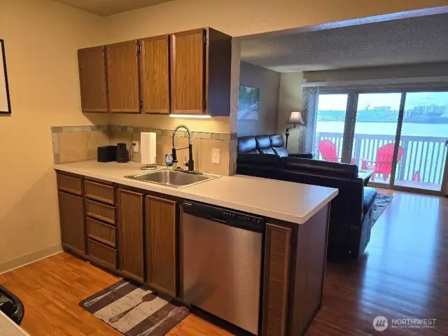 Here is one side of the kitchen to include the sink and dishwasher. We also supply dishes, glasses, silverware, pots and pans, coffee maker and anything else they need to feel at home.