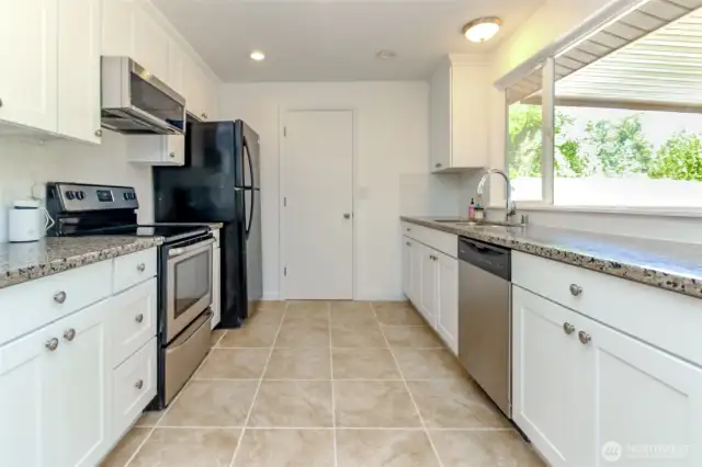 spacious updated kitchen with granite countertops
