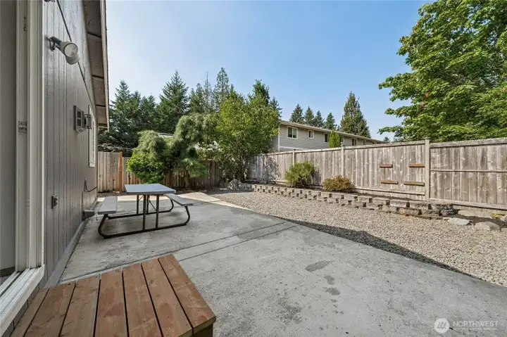 Expansive patio and minimal-maintenance landscaping—outdoor living made easy.