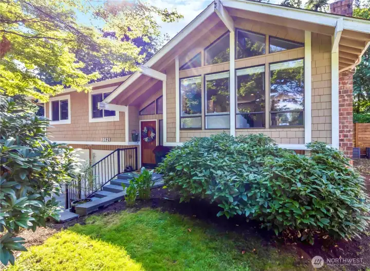 Beautiful light filled home with large windows and private yard
