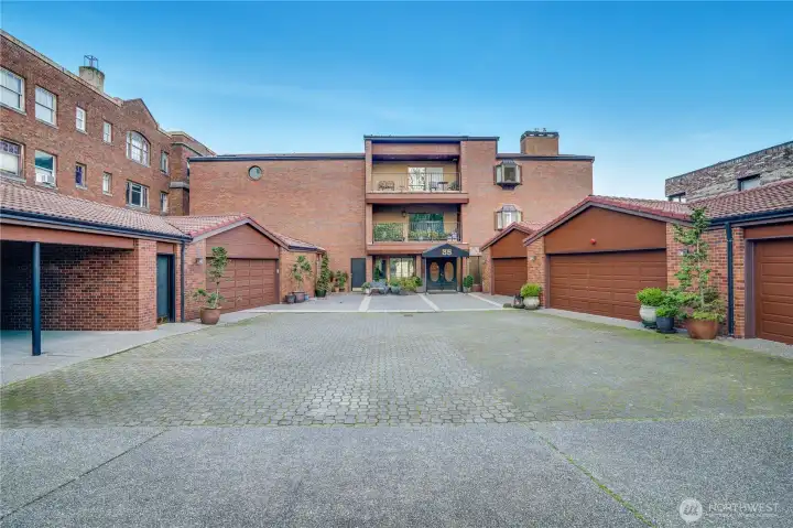 A charming courtyard welcomes you, offering gated access, a secure front entry, and four assigned parking spaces, an exceptional downtown perk