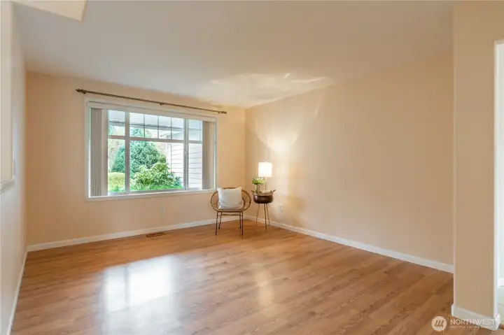 Front room with natural light.  This space could be a formal living room, study, library, entertainment space.
