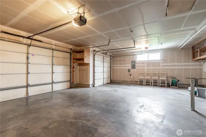 3-car garage with plenty of room for vehicles, shop, and recreational toys.