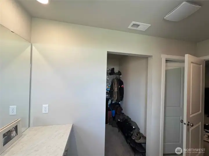 Primary's walk-in closet from bathroom