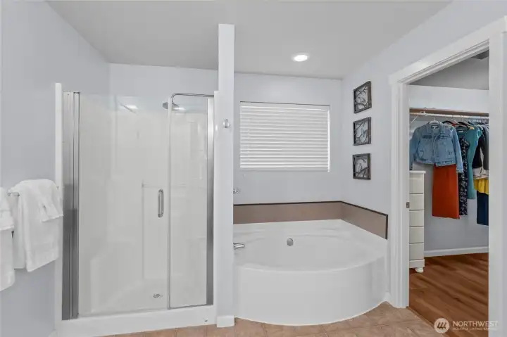 PRIMARY EN SUITE BATHROOM | This bathroom features a separate shower stall and soaker tub.