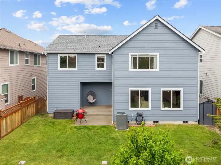 BACK YARD | With a covered concrete patio outside your back door, you have the perfect place to BBQ and enjoy outdoor entertainment.