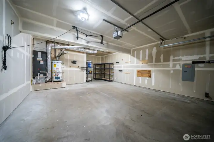 Garage includes several installed storage and organization features that will remain with the home, including a trailer hitch storage mount, mounted power tool organization system, wall-mounted bike and accessory hooks, vehicle roof rack lift system, and wall-mounted hooks for outdoor tool and equipment storage. These additions help maximize garage space and provide convenient storage for recreational gear, tools, and outdoor equipment. Garage includes several installed storage and organization features that will remain with the home, including a trailer hitch storage mount, mounted power tool organization system, wall-mounted bike and accessory hooks, vehicle roof rack lift system, and wall-mounted hooks for outdoor tool and equipment storage. These additions help maximize garage space and provide convenient storage for recreational gear, tools, and outdoor equipment.