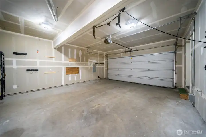 Garage includes several installed storage and organization features that will remain with the home, including a trailer hitch storage mount, mounted power tool organization system, wall-mounted bike and accessory hooks, vehicle roof rack lift system, and wall-mounted hooks for outdoor tool and equipment storage. These additions help maximize garage space and provide convenient storage for recreational gear, tools, and outdoor equipment. Garage includes several installed storage and organization features that will remain with the home, including a trailer hitch storage mount, mounted power tool organization system, wall-mounted bike and accessory hooks, vehicle roof rack lift system, and wall-mounted hooks for outdoor tool and equipment storage. These additions help maximize garage space and provide convenient storage for recreational gear, tools, and outdoor equipment.
