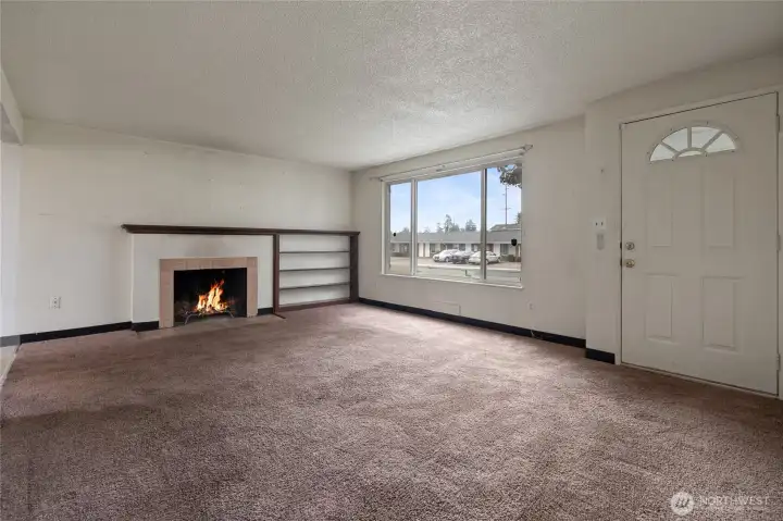 The living room is bright and offers a view of the mountain.