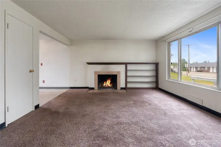 The living room has a wide opening into the kitchen.