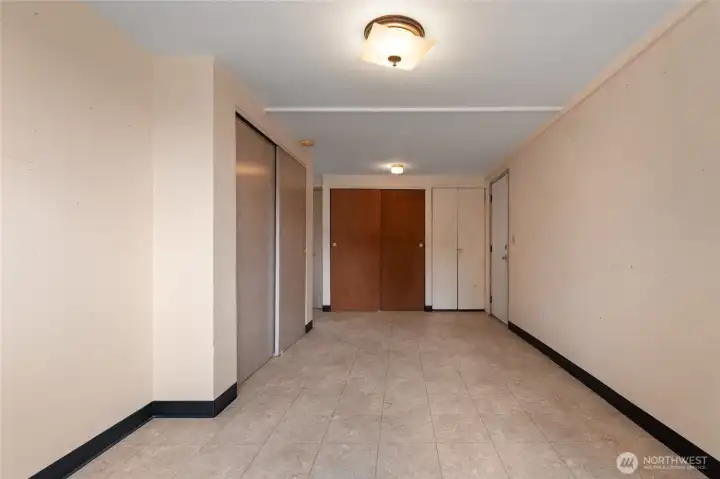 This room holds an additional fridge behind the small doors on the right.