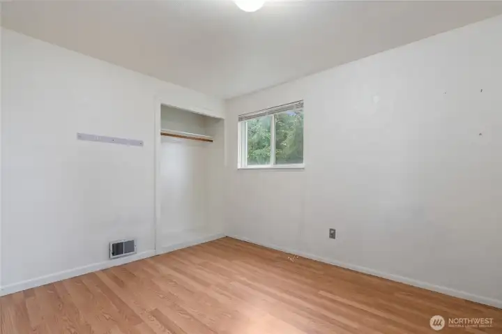 A queen sized bed easily fits into this room.