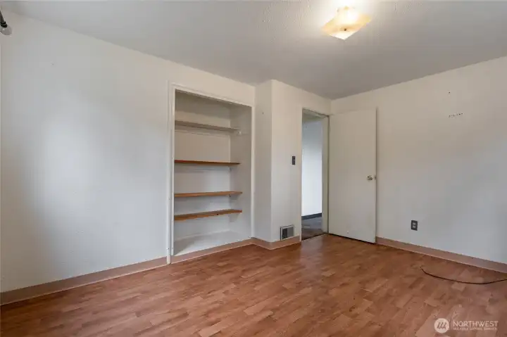 This room will easily hold a queen sized bed.