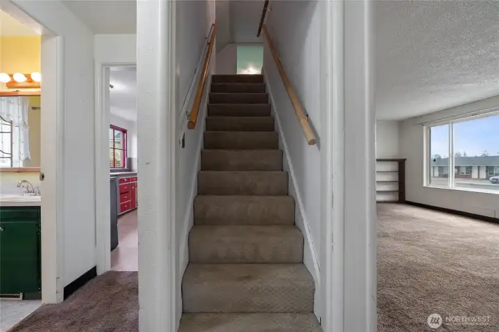 Upstairs you'll find a third bedroom and bonus space.