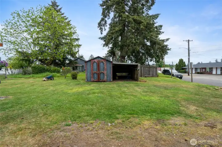 The shed is perfect for yard tools.